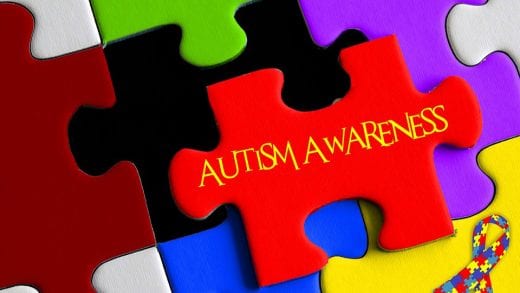 Image shows a jigsaw with the words autism awareness written on it