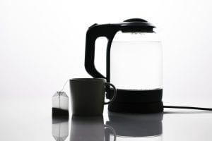 A kettle, mug, and teabag.